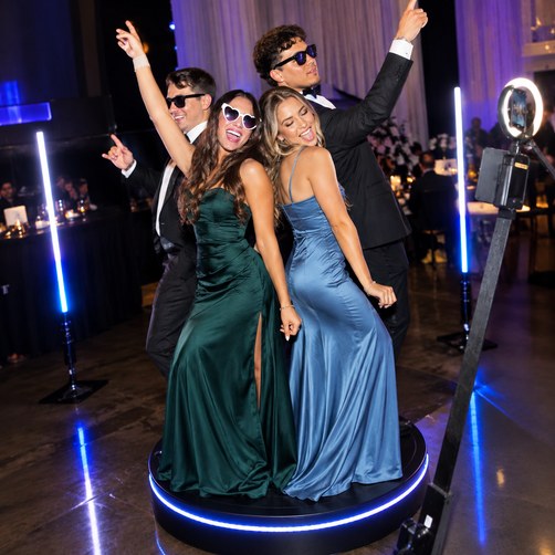 Guests enjoying the 360 photo booth experience