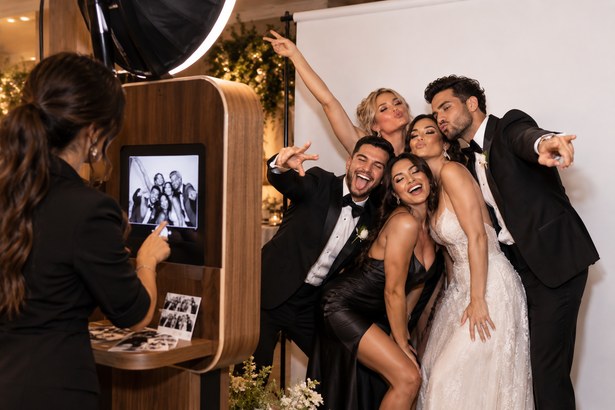 Guests posing at a Glam Booth session
