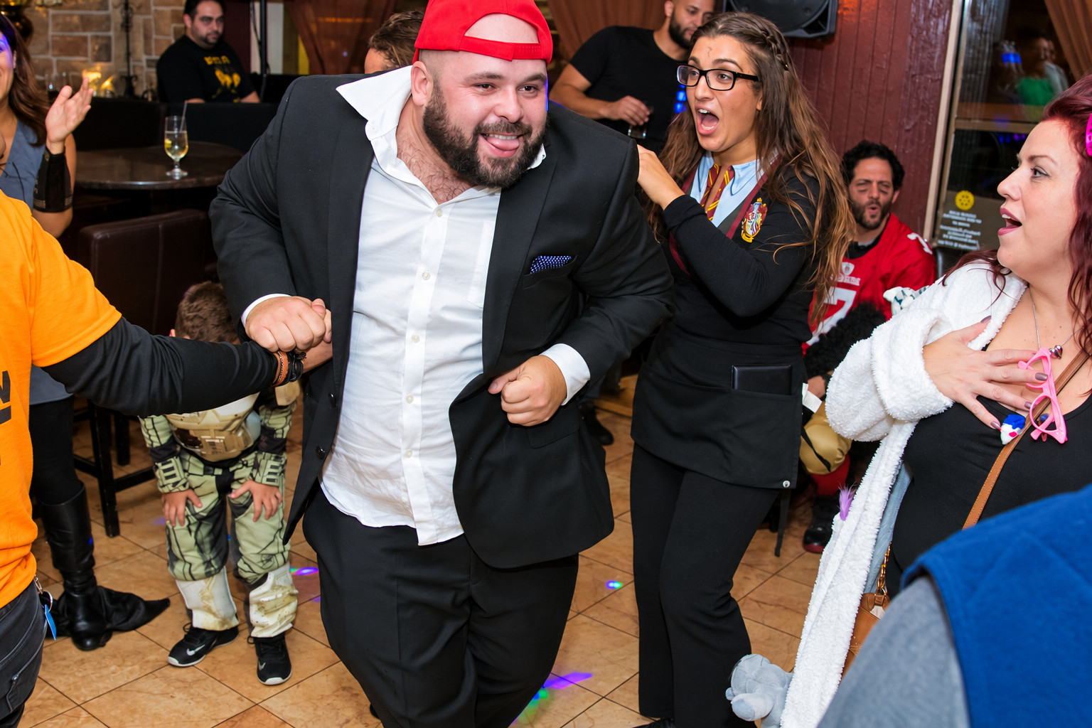 Guests sharing a lively dance floor moment