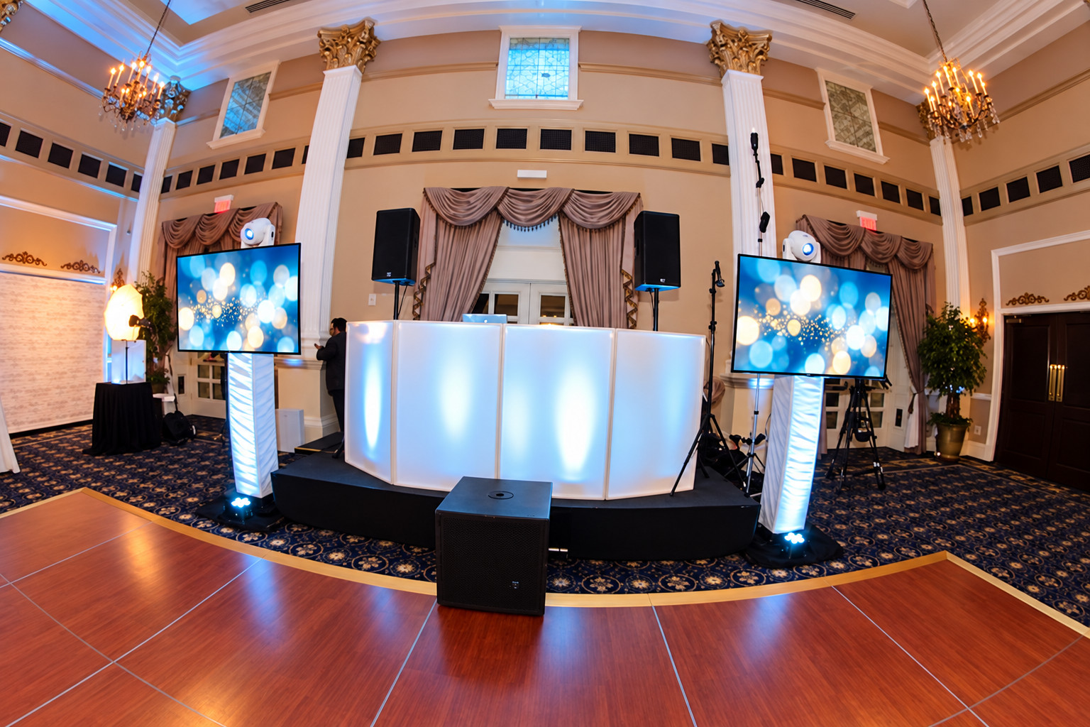 Wedding DJ booth with coordinated display screens
