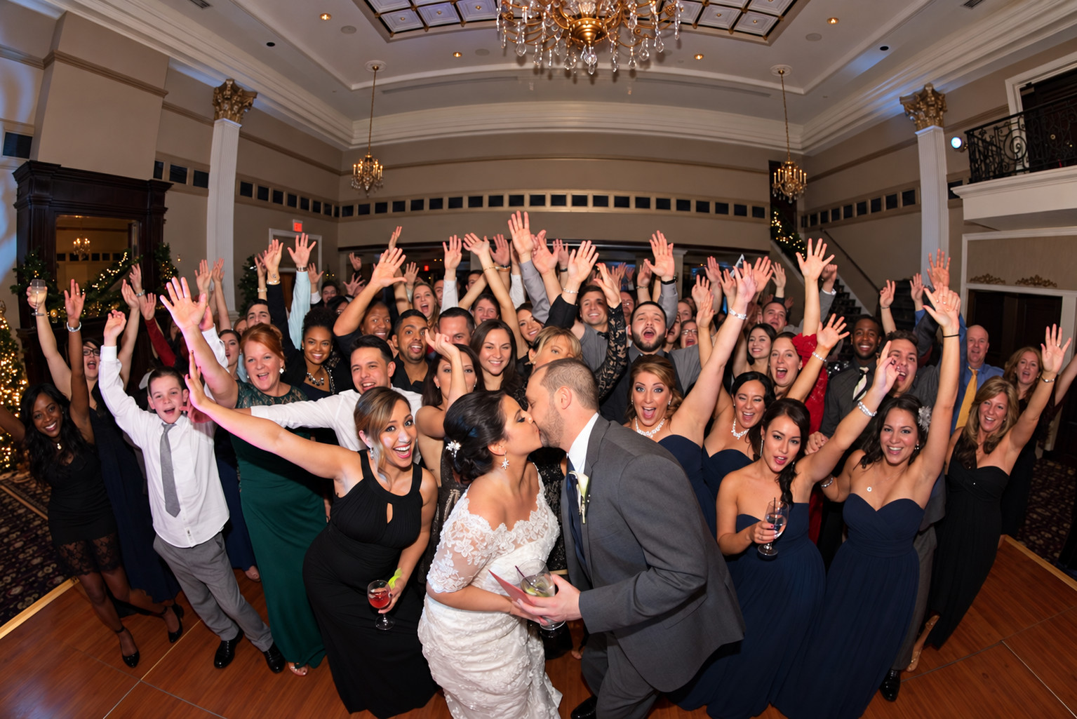 Guests dancing together on a busy event dance floor