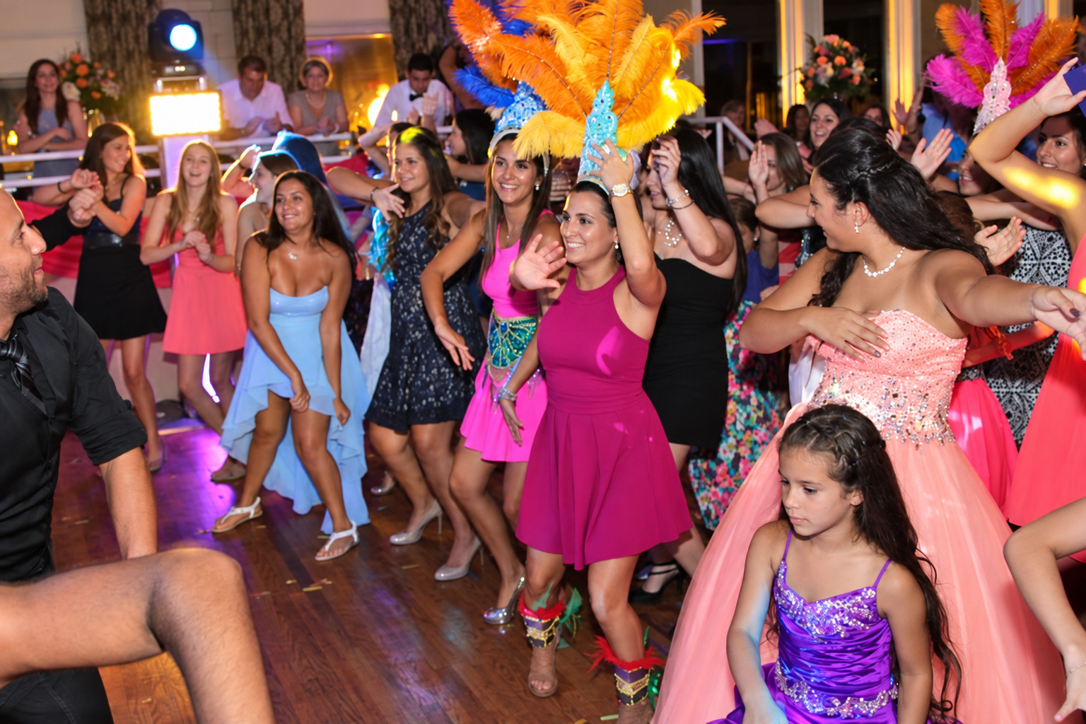 Guests dancing together at a colorful celebration