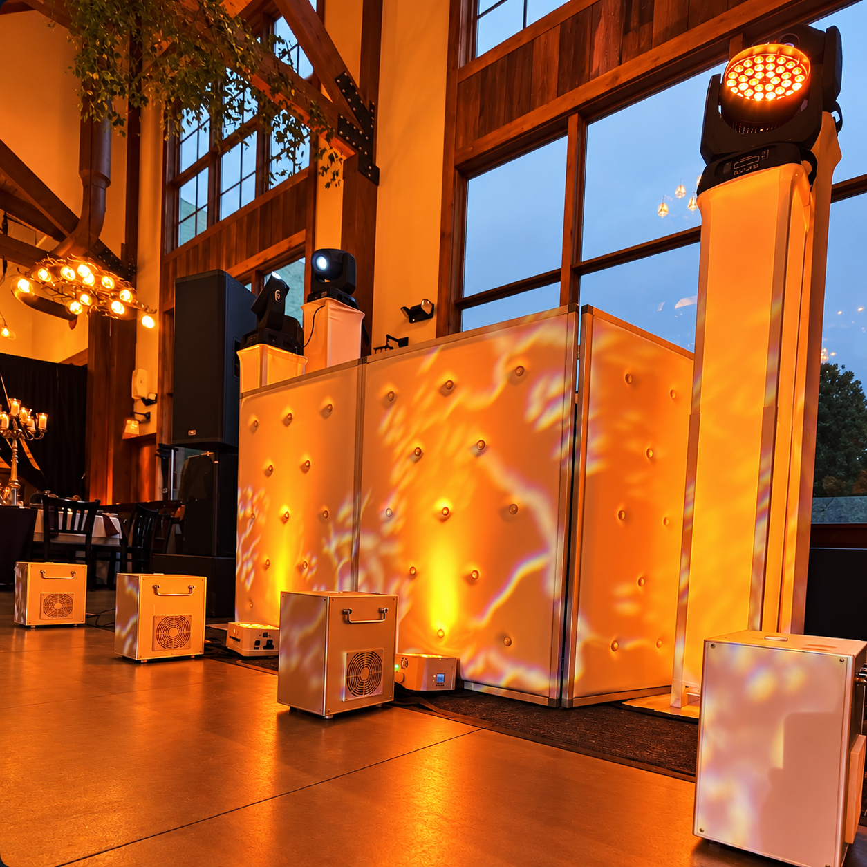 Amber event lighting across a reception room