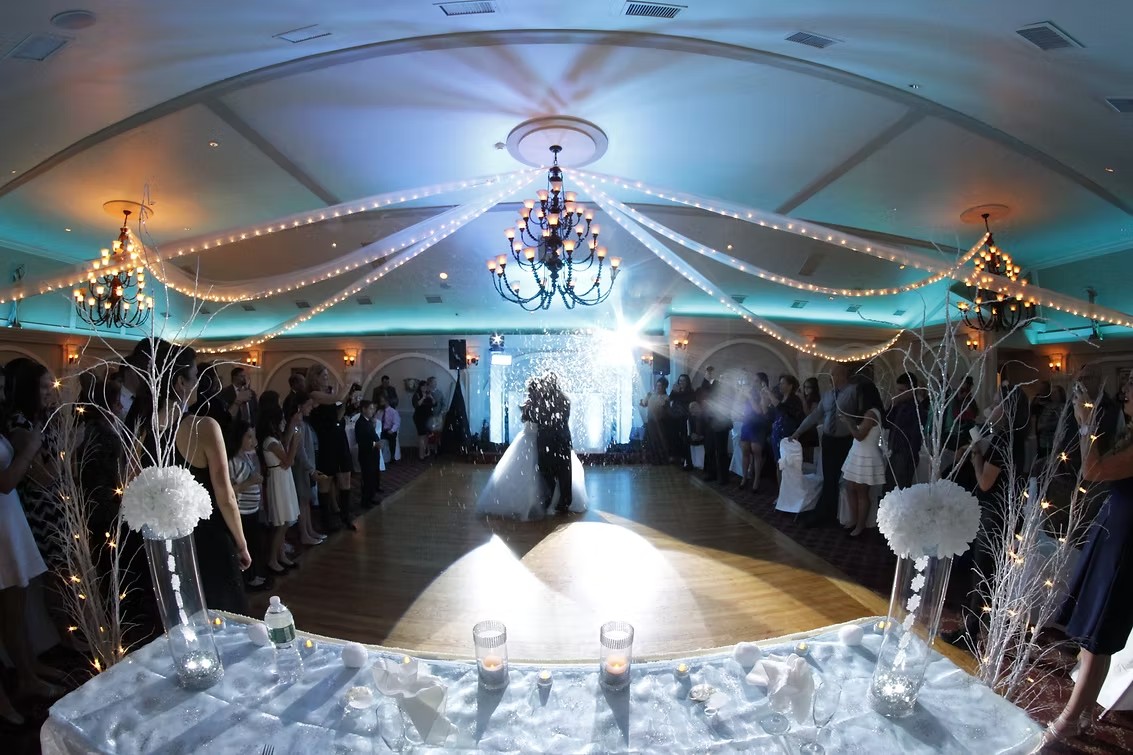 Event room with moving lights and uplighting across the walls