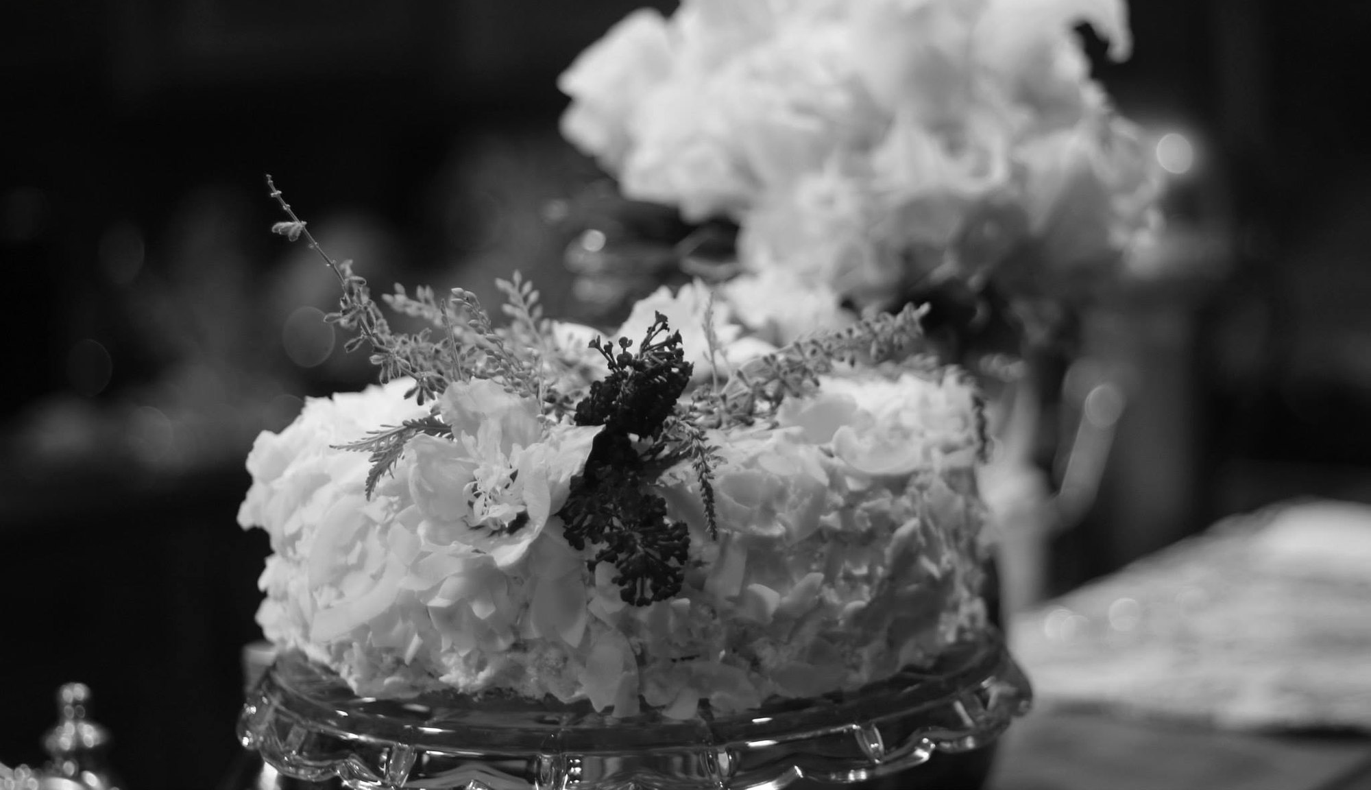Black and white photograph of a wedding cake detail