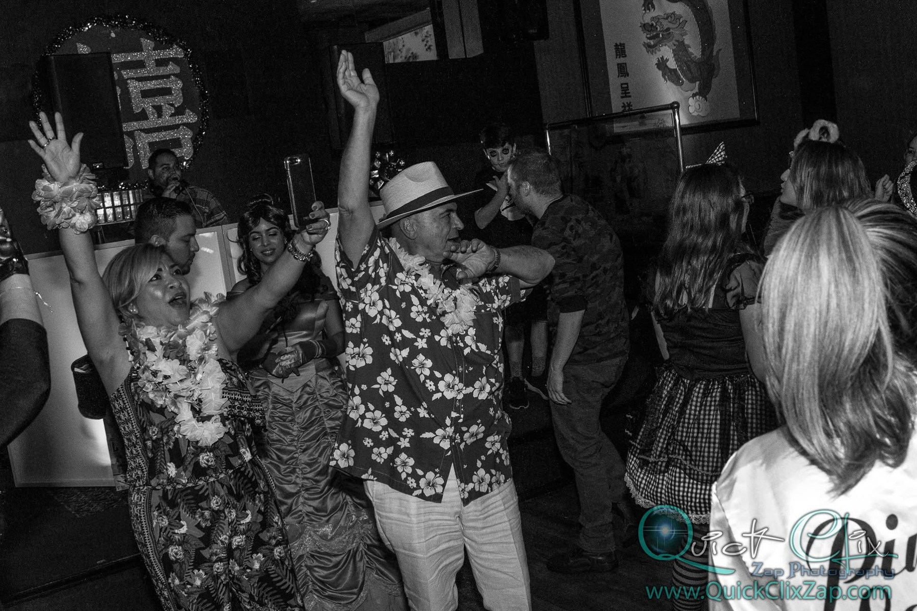 Guests dancing together at a lively celebration