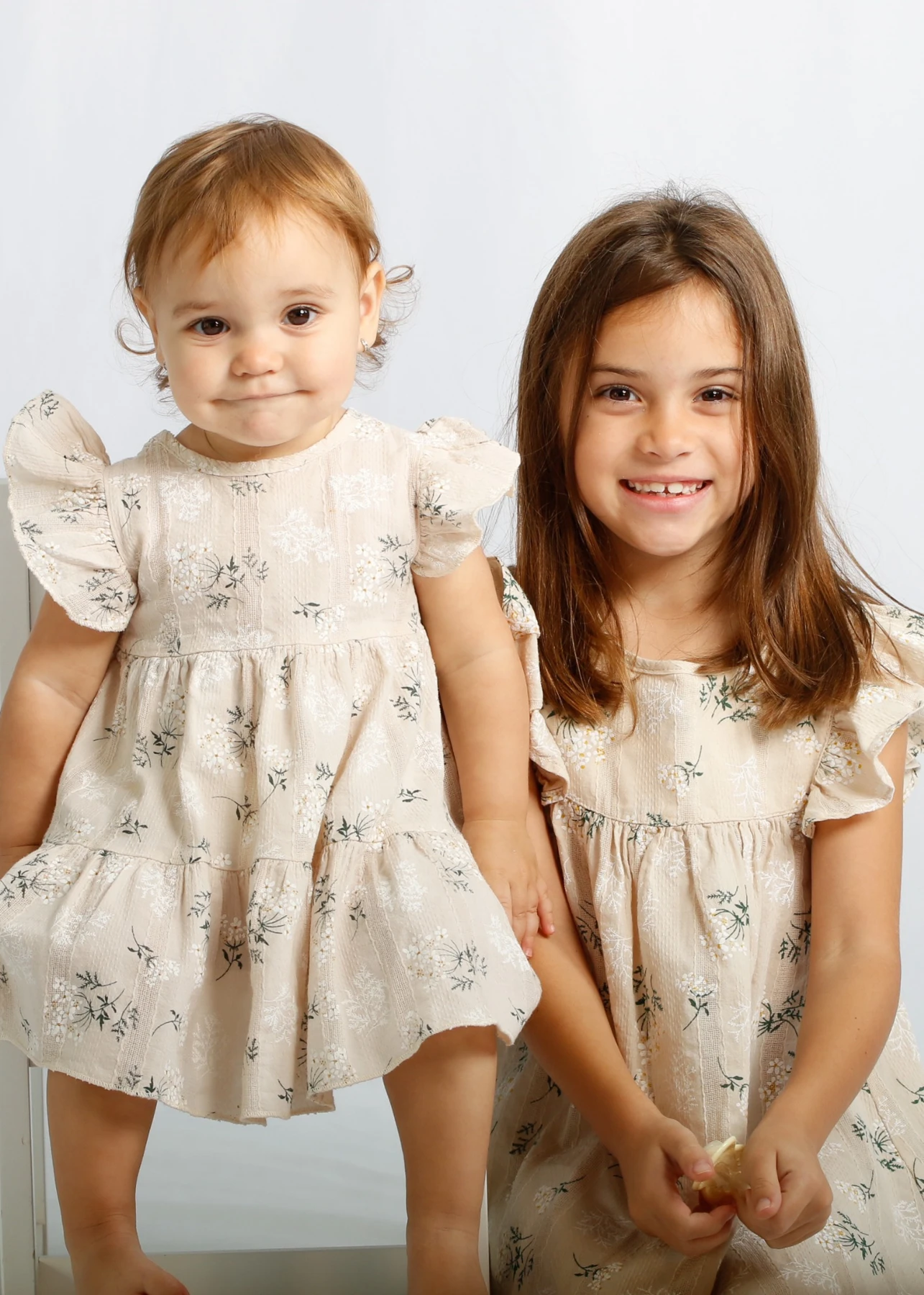 Two children in a studio portrait
