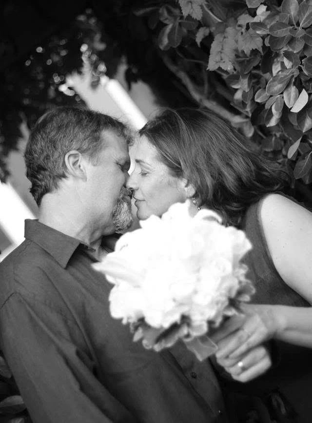 Couple sharing a kiss in black and white