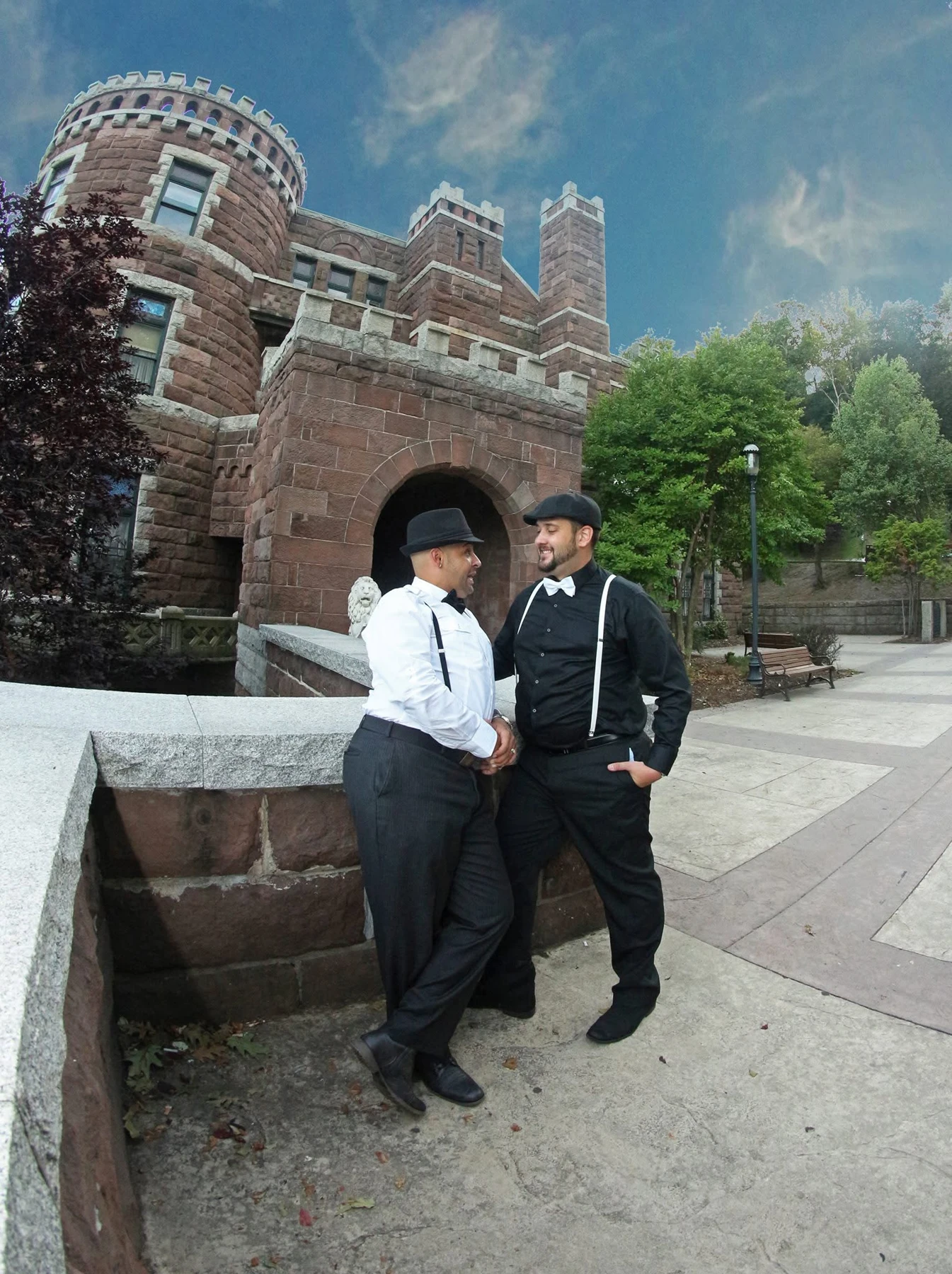 Two boys posing by a castle