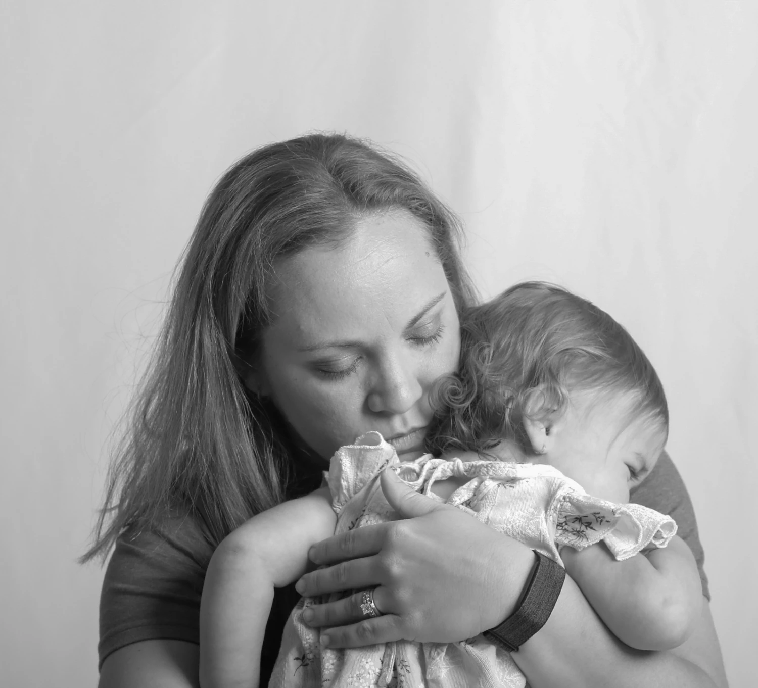Mother kissing her baby